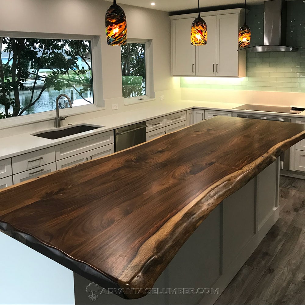 indian rosewood wood slab used as a island counter top in a kitchen