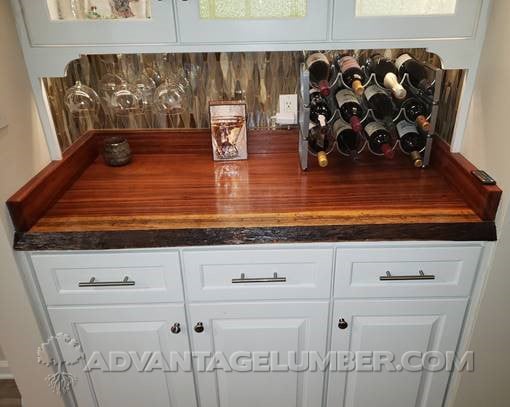 tigerwood wood slab used as a bar top