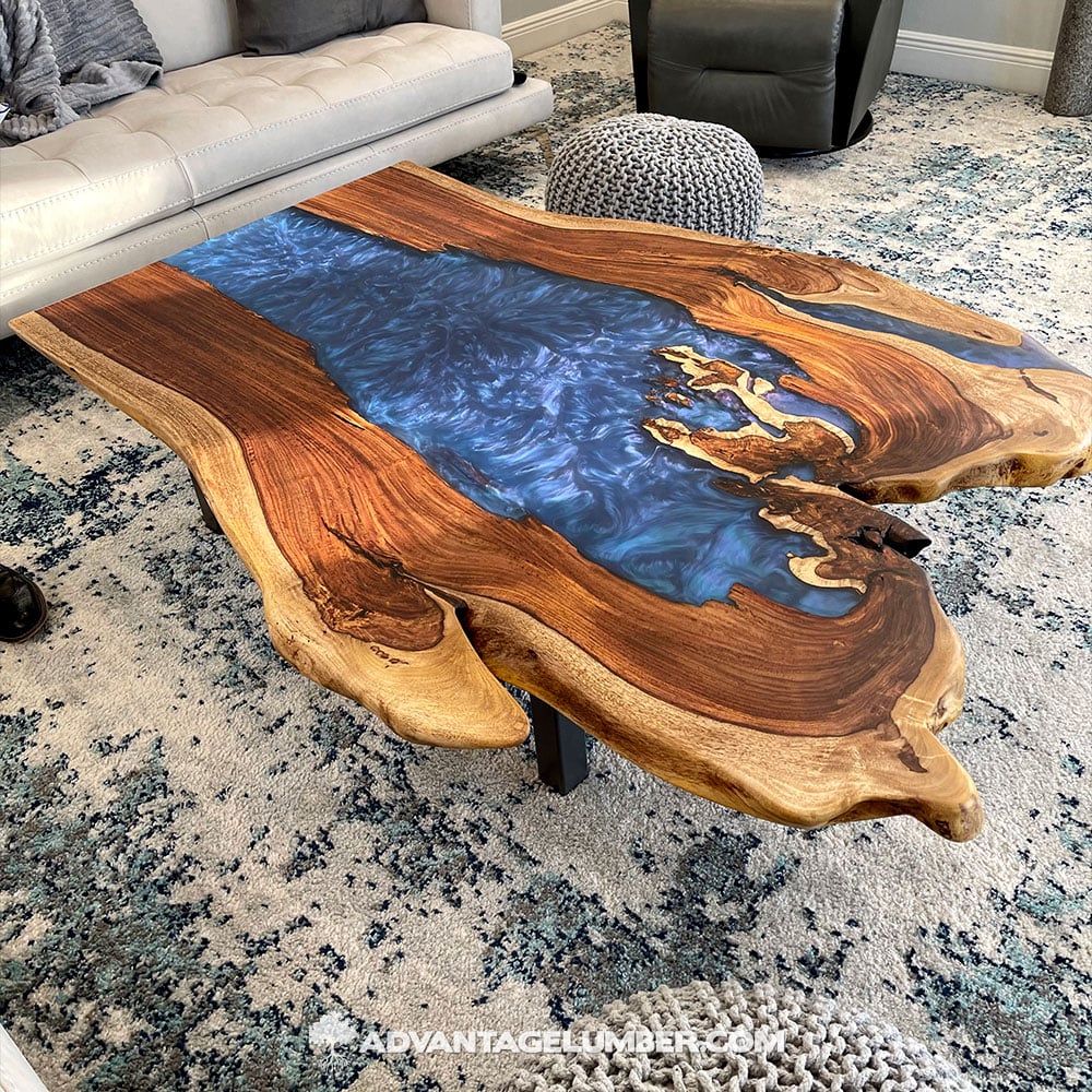  indian rosewood live edge slab with blue epoxy used as a coffee table in a living room