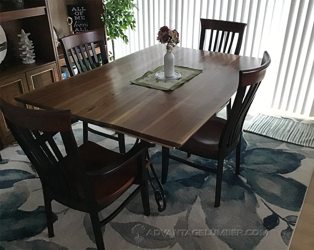walnut wood straight edge slab used as a dinning room  table
