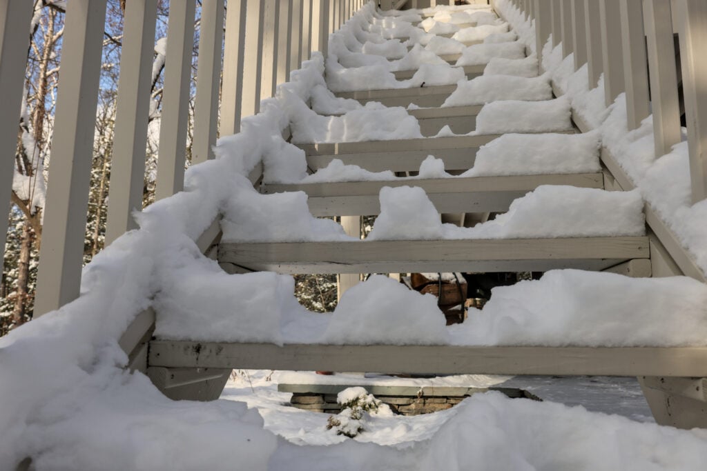 snow covered deck stairs